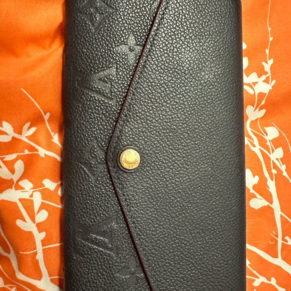 Navy and Red Empreinte Louis Vuitton Sarah wallet.